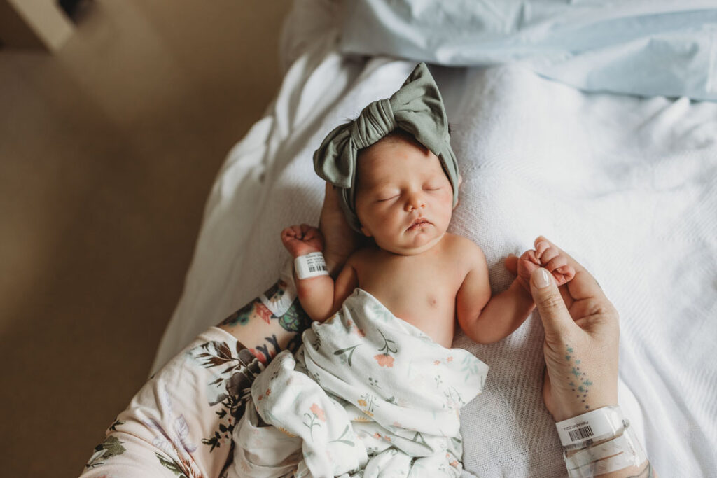 Tiny Toes Photography STL Newborn and Motherhood Photography Photo of new mom in hospital with newborn